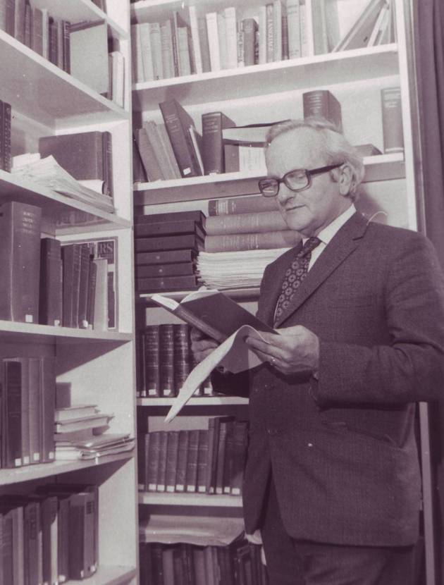 R. W. Burchfield in his office